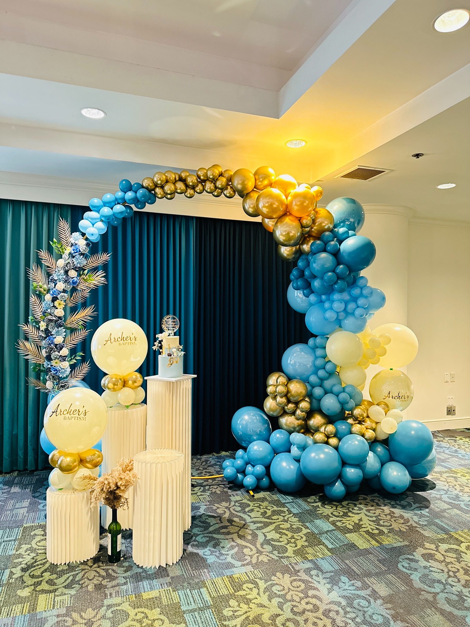 Blue, cream and gold baptism balloon installation
