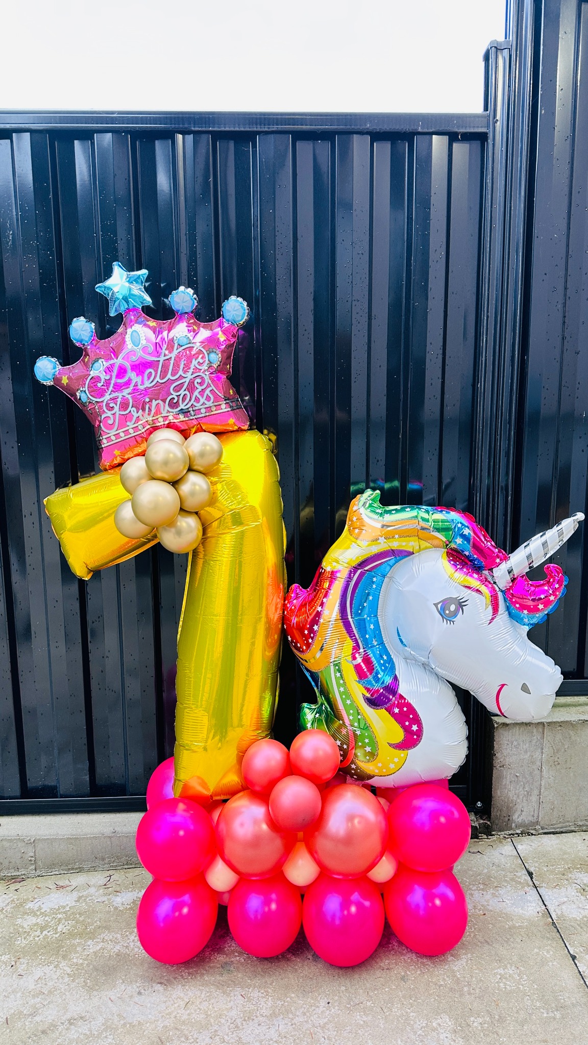 Princess unicorn balloon arrangement for a seventh birthday